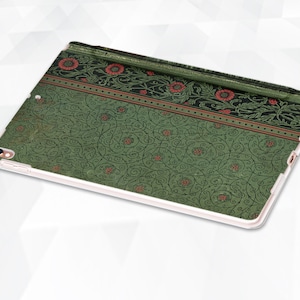 May include: Green iPad case with a floral pattern. The pattern features red flowers and green leaves on a white background.