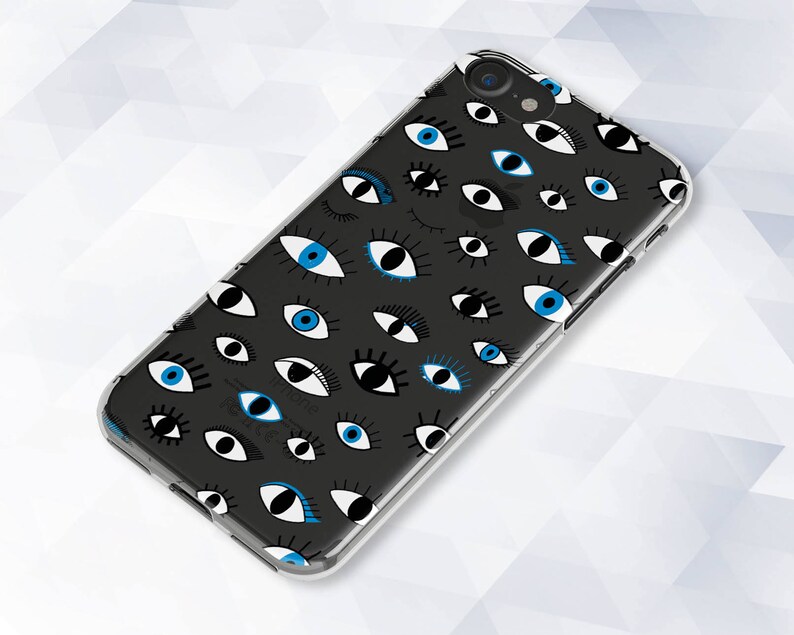 May include: A clear phone case with a black background and a pattern of blue and white eyes.