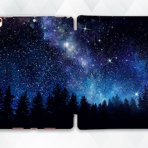 May include: A dark blue phone case with a starry night sky design. The case features a silhouette of a forest against a backdrop of a starry sky with a milky way.