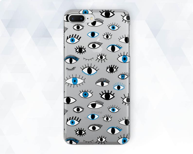 May include: A clear phone case with a pattern of black and blue eyes. The case is designed for an iPhone.