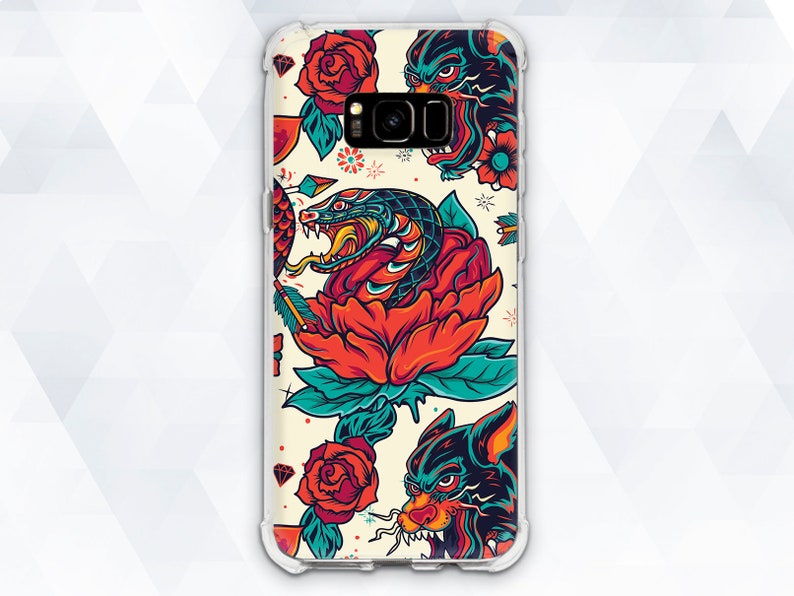 May include: A clear phone case with a colorful tattoo-style design featuring a snake, roses, and wolves. The design is vibrant and detailed, with a white background.