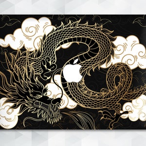 May include: A black laptop skin with a gold dragon design. The dragon is curled around a white apple logo. The background is black with white clouds.