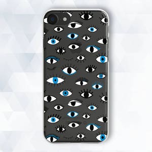 May include: A clear phone case with a black background and a pattern of blue and black eyes. The eyes are of various shapes and sizes.