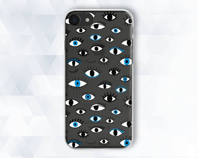May include: A clear phone case with a black background and a pattern of blue and black eyes. The eyes are of various shapes and sizes.