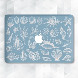 May include: A light blue laptop skin with a white design of various seashells and starfish.