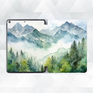 May include: A watercolor painting of a mountain range with a misty forest in the foreground. The mountains are painted in shades of blue and green, and the forest is painted in shades of green and brown.
