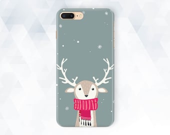May include: A gray phone case with a white snowflake design and a cartoon reindeer wearing a red scarf. The reindeer has brown antlers and a light brown face.
