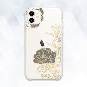 May include: A clear phone case with a white background and gold floral design. The case has a black camera cutout and a black floral design.