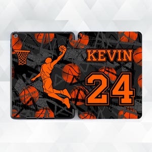 May include: Black and orange basketball-themed iPad case with a silhouette of a basketball player, a basketball hoop, and the text "KEVIN 24".