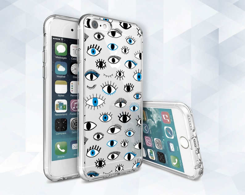 May include: A clear phone case with a white background and a pattern of blue and black eyes. The case is designed for an iPhone.