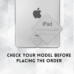 May include: A white iPad with the Apple logo and the text "iPad" on the back. The text "Designed by Apple in California Assembled in China Model A1566 FCC ID: QCN-A1566 IC: 579C-A1566" is also visible on the back.