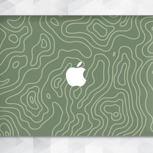 May include: Green laptop skin with a white Apple logo and a topographic map pattern.