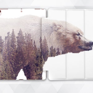 May include: A white and brown bear with a forest overlay, printed on a white iPad case.