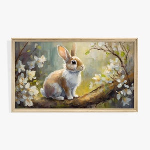 May include: A painting of a brown and white rabbit sitting on a branch with white flowers. The rabbit is looking to the right and the background is a soft green and yellow.