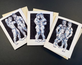 May include: Three greeting cards with pen and ink illustrations of muscular figures in various poses. The illustrations are in shades of blue and gray, set against a black patterned background. Each card is paired with a cream-colored envelope.