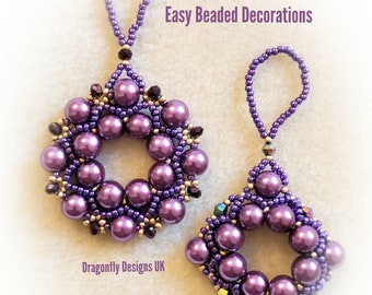 May include: Two purple beaded ornaments with a loop for hanging. The ornaments are made with small purple beads and have a circular shape. The text "Easy Beaded Decorations" is visible above the ornaments.