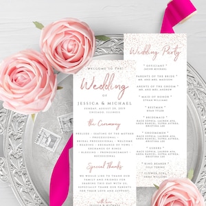 May include: A wedding ceremony programme with a pink and white design. The programme includes the names of the wedding party, the officiant, and the order of the ceremony. The text "Welcome to the Wedding of Jessica & Michael" is at the top of the programme.