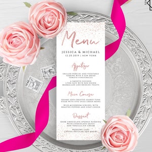 May include: A wedding menu card with a white background and pink glitter. The text on the card reads "Menu", "Jessica & Michael", "12.20.2019 | New York", "Appetizer", "Grilled Porcini and Vegetable Terrine with a Sun Dried Tomato Vinaigrette", "A Smooth Chicken Liver Pate with Red Onion Marmalade and Brioche Toasts", "Main Course", "Sesame Seed-Crusted Seared Tuna Steak with Five Spice Green Beans", "Wild Mushroom Scrudel with Roasted Peppers and Goat Cheese", "Dessert", "Dark Chocolate Sponge Pudding with Chocolate Sauce and Vanilla Ice Cream", "Wedding Cake", "Coffee-Regular and Decaf".