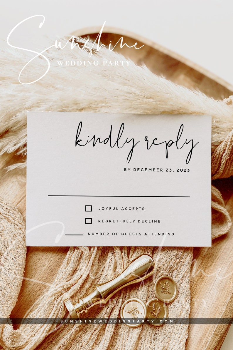 May include: A wedding RSVP card with the words "kindly reply" in elegant script. The card includes checkboxes for acceptance or regret, and a line for the number of guests. A gold wax seal and stamp are also visible.