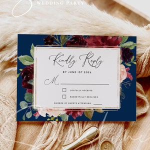 May include: A navy blue wedding RSVP card with a gold border and floral design. The text reads "Kindly Reply by June 1st 2024". There are two checkboxes for "Joyfully Accepts" and "Regretfully Declines".