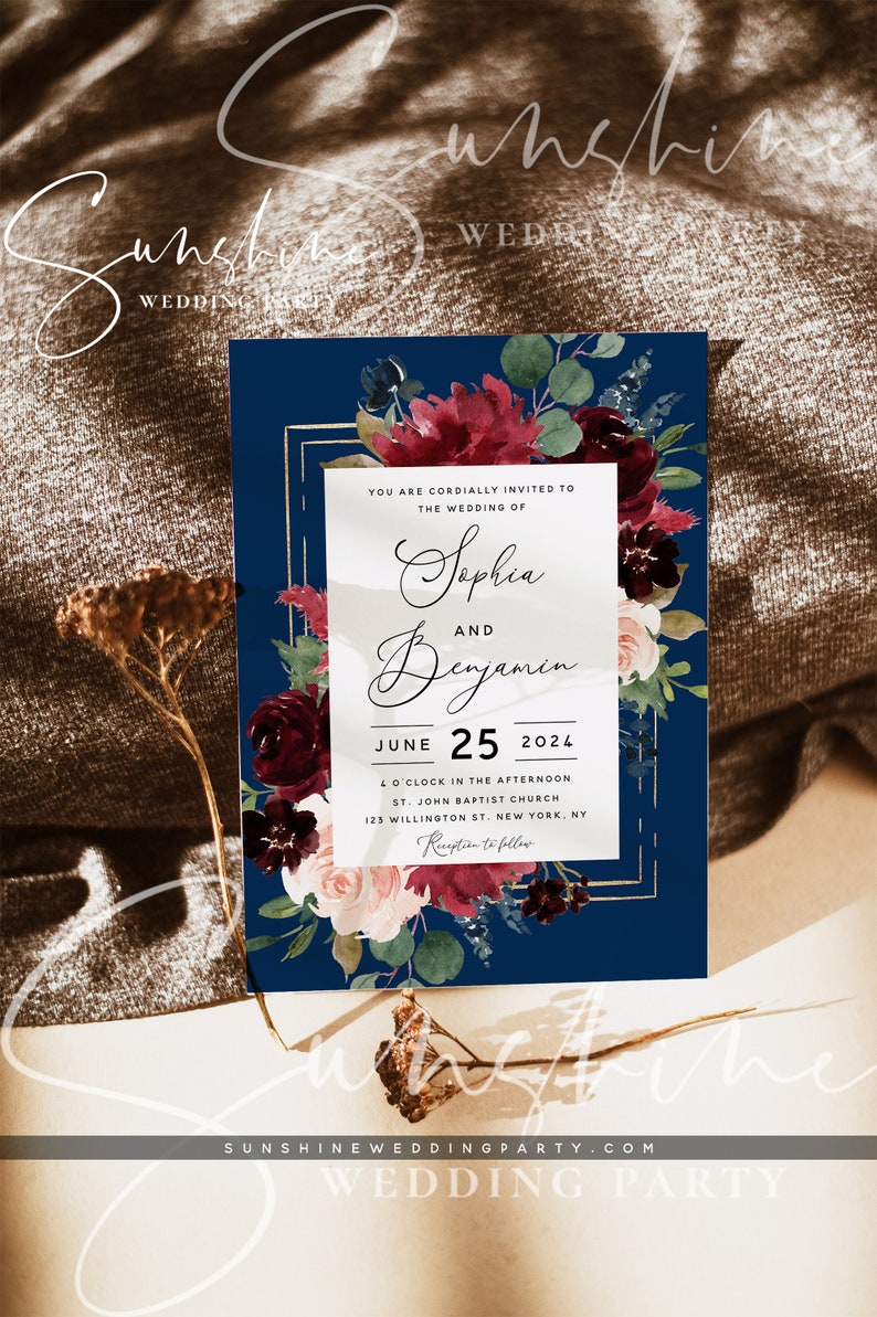 May include: A navy blue wedding invitation with a gold frame and burgundy floral design. The invitation reads "You are cordially invited to the wedding of Sophia and Benjamin June 25, 2024 4 o'clock in the afternoon St. John Baptist Church 125 Willington St. New York, NY Reception to follow"