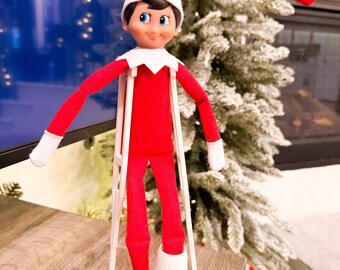 Elf Doll Crutches & Cast Set – Funny Christmas Injury Scene Prop