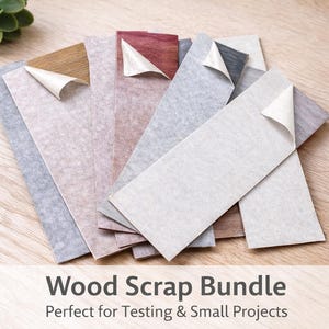 May include: A bundle of wood scraps in various colors, including gray, brown, and red, with a corner of the top layer peeled back to reveal the adhesive. The text "Wood Scrap Bundle" is visible.
