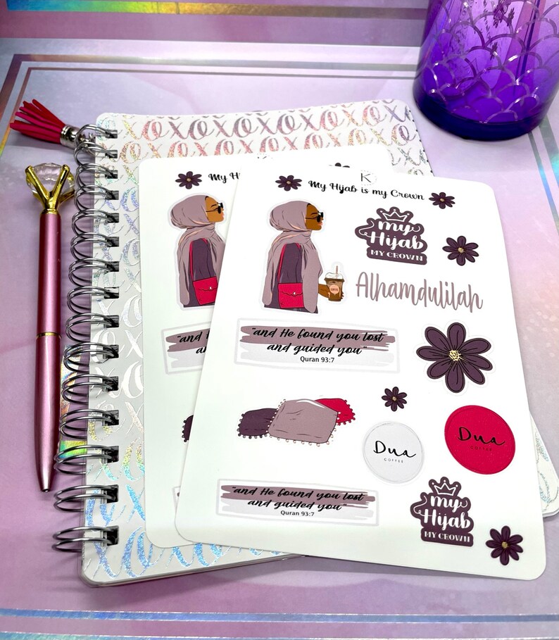 May include: A set of stickers featuring a woman wearing a hijab and the text "My Hijab is my Crown". The stickers also include the text "Alhamdulilah" and a quote from the Quran: "And He found you lost and guided you."  The stickers are on a white background.