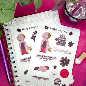 May include: A set of stickers featuring a woman wearing a hijab, a crown, and the text "My Hijab is my Crown". The stickers also include the text "Alhamdulilah", "Dua", and a Quran verse.