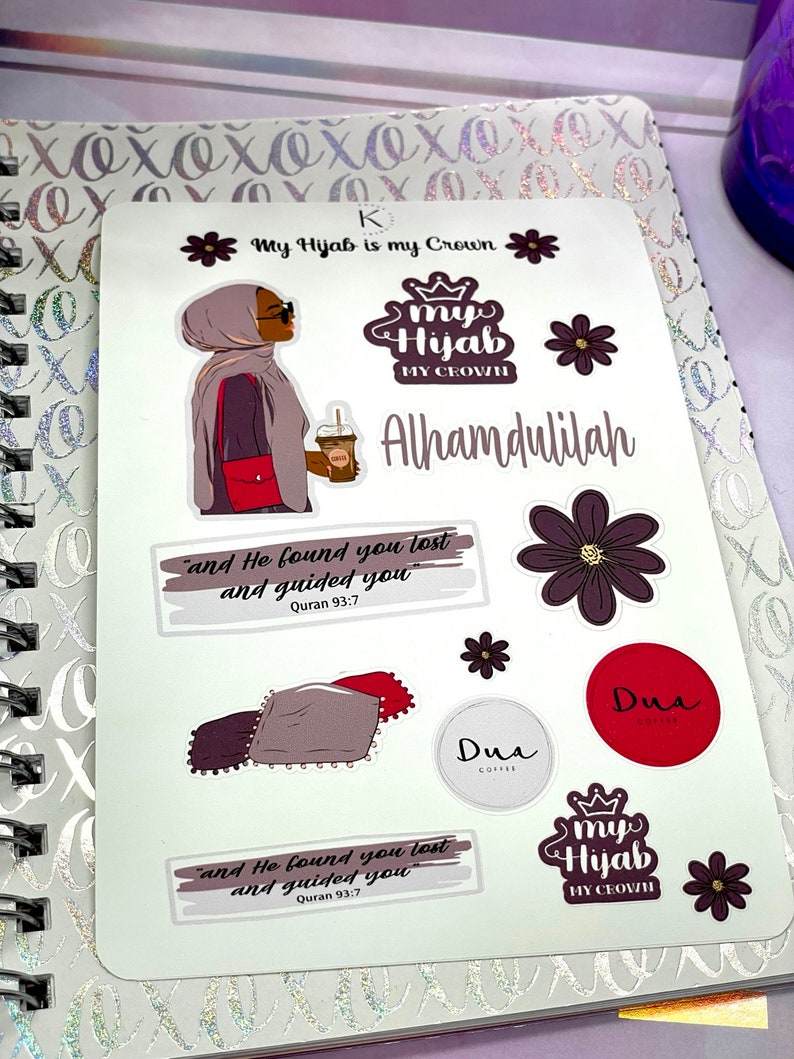 May include: A set of stickers with a Muslim theme. The stickers feature a woman wearing a hijab, the words "My Hijab is my Crown", "Alhamdulilah", and "Dua", and a quote from the Quran: "and He found you lost and guided you".