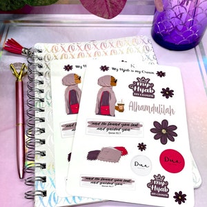 May include: A set of stickers featuring a woman wearing a hijab, a crown, and the text "My Hijab is my Crown". The stickers also include the text "Alhamdulilah", "Dua", and a Quran verse. The stickers are on a white background.
