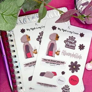 May include: A set of stickers featuring a woman wearing a hijab and holding a cup of coffee. The stickers include the text "My Hijab is my Crown", "Alhamdulillah", and a Quran verse. The stickers are on a white background.