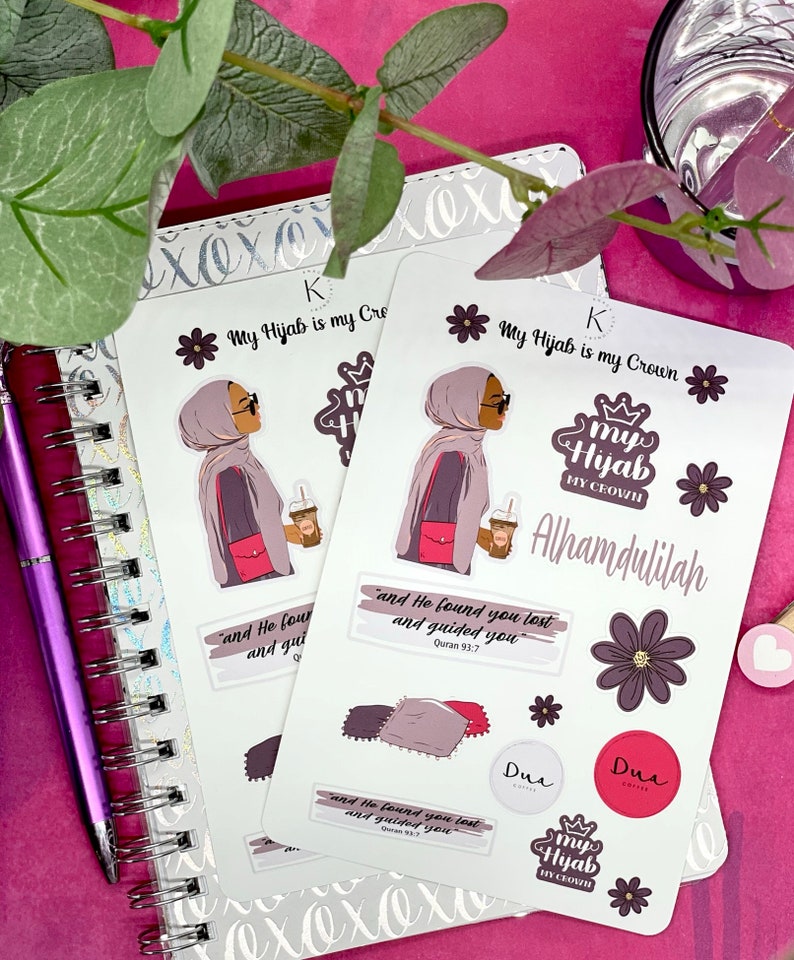 May include: A set of stickers featuring a woman wearing a hijab and holding a cup of coffee. The stickers include the text "My Hijab is my Crown", "Alhamdulillah", and a Quran verse. The stickers are on a white background.