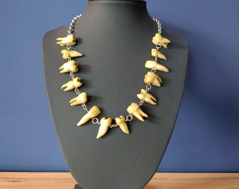 Aged human teeth necklace on silver (look) chain