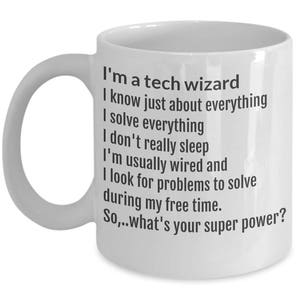 May include: White ceramic mug with a curved handle. The mug features black text that reads, "I'm a tech wizard...So,..what's your super power?" A humorous gift for tech enthusiasts.