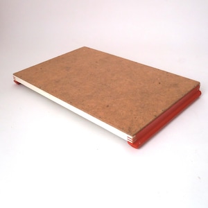 May include: A rectangular wooden tray with a light brown finish and red painted edges. The tray is made of wood and has a simple design.