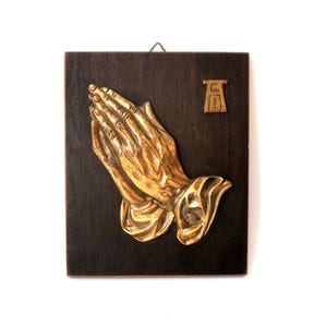 Vintage religious wall plaque praying hands by Albrecht Dürer, solid brass hands on wooden board wall hanging, mid century wall decor