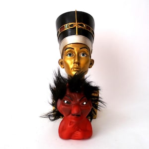 Vintage souvenir bust of Nefertiti, used sculpture bust head of Nefertiti queen from ancient Egypt, sculptural art of the Amarna period