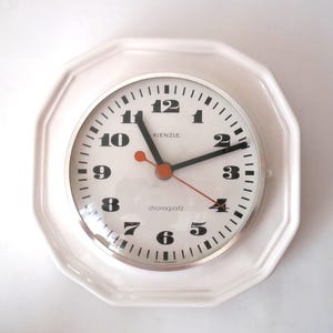 Vintage Ceramic wall clock white twelve-sided kitchen wall clock, West Germany, mid century modern pottery clock, 1970s, 70s space age clock