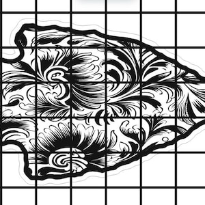 May include: Black and white illustration of a stylized arrowhead with a floral design. The arrowhead is outlined in black and filled with intricate swirls and patterns.