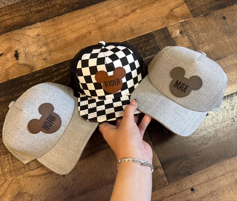 May include: A rustic wooden sign with the text "Welcome to our home" in white lettering. The sign has a distressed finish and a simple, inviting design, suitable for a front porch or entryway.