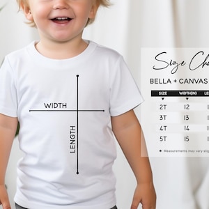 Peut inclure: Tableau des tailles pour les t-shirts Bella + Canvas 3001T, indiquant les mesures de largeur et de longueur en pouces pour les tailles 2T, 3T, 4T et 5T. Les mesures peuvent varier l&eacute;g&egrave;rement.