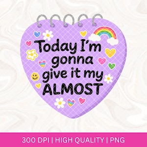 May include: A lilac heart-shaped notepad with a grid pattern and silver spiral binding. The notepad features the text "Today I'm gonna give it my ALMOST" in black, along with colourful illustrations of hearts, flowers, a rainbow, and a smiley face.