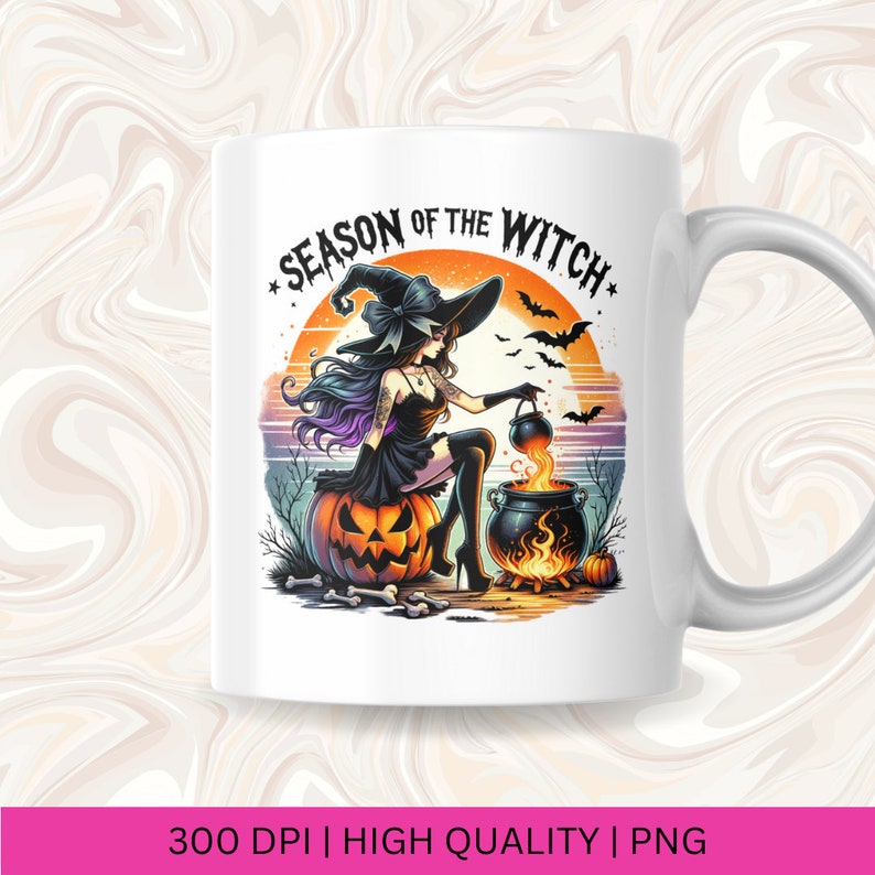 May include: A white ceramic mug featuring a colourful illustration of a witch stirring a cauldron. The witch is seated on a pumpkin and the text "Season of the Witch" is written in a circle around the image.