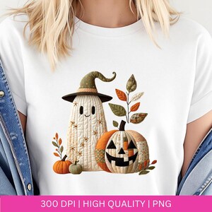 May include: White t-shirt featuring a Halloween-themed design. The design includes a friendly ghost wearing a witch hat, a jack-o'-lantern, and autumn leaves. The image also includes the text "300 DPI | HIGH QUALITY | PNG".