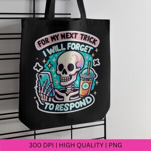 May include: Black tote bag with a white skeleton holding a phone and a pink and orange iced coffee. The text on the bag reads "For my next trick I will forget to respond".