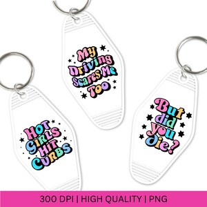 May include: Three white keychains with colorful text. The first keychain says "Hot Girls Hit Curbs". The second keychain says "My Driving Scares Me Too". The third keychain says "But Did You Die?"