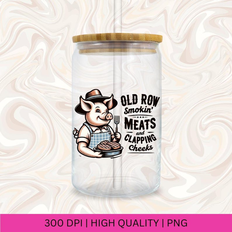 May include: A clear glass jar with a bamboo lid and a straw. The jar has a cartoon pig wearing a chef's hat and holding a spatula and a plate of grilled meat. The text on the jar reads "Old Row Smokin' Meats and Clapping Cheeks".