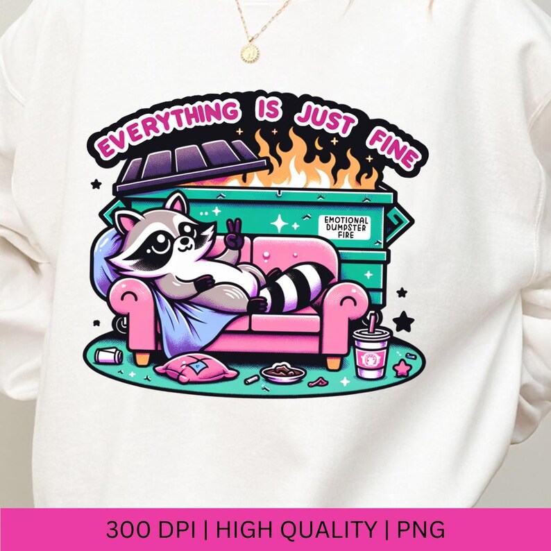 May include: A white sweatshirt with a graphic design of a raccoon sitting on a pink couch in front of a green dumpster with flames coming out of it. The text "Everything is just fine" is above the dumpster and the text "Emotional Dumpster Fire" is on the side of the dumpster.