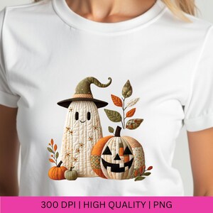 May include: White t-shirt featuring a Halloween-themed design. The design includes a smiling ghost wearing a witch hat, a patchwork pumpkin with a carved face, and autumn leaves. The text "300 DPI | HIGH QUALITY | PNG" is at the bottom.